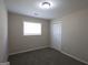 Cozy bedroom with neutral carpeting, window, and closet at 3578 Sherbrooke Sw Way, Atlanta, GA 30331