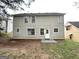 Exterior view of the back of the house with a door and multiple windows at 3228 Rivermist Cv, Decatur, GA 30034