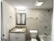 Bathroom featuring marble-style wall tile, a granite sink, and updated fixtures at 3228 Rivermist Cv, Decatur, GA 30034