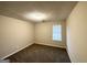 Standard bedroom with neutral paint, carpeting, and a window for natural light at 3228 Rivermist Cv, Decatur, GA 30034