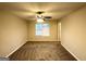 Cozy bedroom featuring carpet flooring, a ceiling fan and a window for natural light at 3228 Rivermist Cv, Decatur, GA 30034