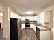 Updated kitchen featuring stainless steel appliances, granite countertops, and white cabinetry at 3228 Rivermist Cv, Decatur, GA 30034