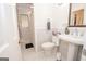 Classic bathroom featuring white fixtures, marble accents, and a window for natural light, creating a refreshing space at 107 Rolling Grn, Peachtree City, GA 30269