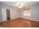 Cozy bedroom with wood-look flooring and a window at 107 Rolling Grn, Peachtree City, GA 30269
