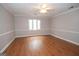 Minimalist bedroom with natural light, smooth flooring, and clean walls at 107 Rolling Grn, Peachtree City, GA 30269