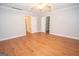 Bright bedroom with wood floors, neutral walls, and ample closet space at 107 Rolling Grn, Peachtree City, GA 30269