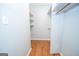 Functional closet space with wooden shelves and hanging rods for organization at 107 Rolling Grn, Peachtree City, GA 30269