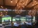 Bright dining area with golf course views and decorative starburst chandeliers at 107 Rolling Grn, Peachtree City, GA 30269