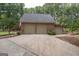 Detached three-car garage with brick exterior, ample parking space and driveway at 107 Rolling Grn, Peachtree City, GA 30269