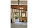 Garage interior showing door to brick-paved area, plus space for parking and storage at 107 Rolling Grn, Peachtree City, GA 30269