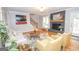 Bright living room features a fireplace, wooden mantel, a staircase, and hardwood floors at 107 Rolling Grn, Peachtree City, GA 30269