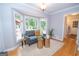 Cozy sitting room with bay window, a view of the backyard, and comfortable seating at 107 Rolling Grn, Peachtree City, GA 30269