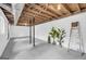 Unfinished basement featuring exposed wooden beams, painted walls, and plumbing in the ceiling at 2694 Benjamin E Mays Sw Dr, Atlanta, GA 30311