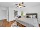 Comfortable bedroom with hardwood floors, neutral tones, a ceiling fan, and ample natural light at 2694 Benjamin E Mays Sw Dr, Atlanta, GA 30311