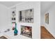 Charming fireplace with white brick surround and built-in shelves, perfect for cozy evenings at 2694 Benjamin E Mays Sw Dr, Atlanta, GA 30311