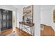 Stylish foyer with hardwood floors, modern console table, artwork, and a view of the entry door at 2694 Benjamin E Mays Sw Dr, Atlanta, GA 30311