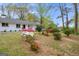 Landscaped front yard with flowering azaleas adding color and charm to the property's curb appeal at 2694 Benjamin E Mays Sw Dr, Atlanta, GA 30311