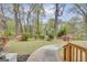 Charming front yard with lush greenery, mature trees, and a curved walkway leading to the home's entrance at 2694 Benjamin E Mays Sw Dr, Atlanta, GA 30311