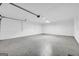 Spacious garage with painted brick walls and a concrete floor, ready for parking and storage at 2694 Benjamin E Mays Sw Dr, Atlanta, GA 30311