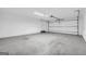 Wide garage with a new garage door and side door, offering ample space for vehicles and storage at 2694 Benjamin E Mays Sw Dr, Atlanta, GA 30311