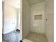 Bathroom featuring modern tile work and contemporary design elements at 4585 Parkwood Rd, Social Circle, GA 30025