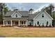 Craftsman home with a welcoming front porch and meticulously landscaped front yard at 4585 Parkwood Rd, Social Circle, GA 30025