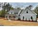 Charming home with a welcoming front porch and meticulously landscaped front yard at 4585 Parkwood Rd, Social Circle, GA 30025