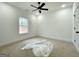 Bedroom features a ceiling fan, a single window and closet at 4601 Parkwood Rd, Social Circle, GA 30025