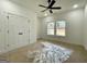 Bedroom features a ceiling fan, double window and closet at 4601 Parkwood Rd, Social Circle, GA 30025