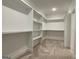 Walk-in closet with custom shelving offers lots of storage at 4601 Parkwood Rd, Social Circle, GA 30025