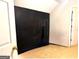Empty carpeted bedroom with dark chalkboard wall and two white doors at 1090 Crown River Pkwy, Mcdonough, GA 30252