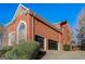 Spacious two-car garage with an adjacent arched window at 1090 Crown River Pkwy, Mcdonough, GA 30252