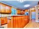 Well-appointed kitchen featuring custom wood cabinets, granite countertops, and stainless steel appliances at 1090 Crown River Pkwy, Mcdonough, GA 30252
