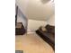 Spacious living room with angled walls and comfortable seating arrangement with neutral carpet at 1090 Crown River Pkwy, Mcdonough, GA 30252