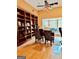 Large home office with built in book cases and a large window at 1090 Crown River Pkwy, Mcdonough, GA 30252