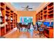 Large office featuring custom built-in shelving, hardwood floors and natural light at 1090 Crown River Pkwy, Mcdonough, GA 30252