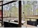 Comfortable patio seating with an outdoor heater that overlooks a wooded backyard view through large windows at 1090 Crown River Pkwy, Mcdonough, GA 30252