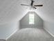 Spacious room with neutral paint, gray carpet, ceiling fan, and window at 100 Hugh Dr, Covington, GA 30016