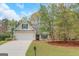 Charming single-Gathering home featuring a well-manicured lawn and inviting two-car garage at 100 Hugh Dr, Covington, GA 30016