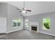 Spacious living room with vaulted ceilings, large windows and cozy fireplace at 100 Hugh Dr, Covington, GA 30016