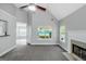 Open living area featuring a corner fireplace, ceiling fan and neutral decor at 100 Hugh Dr, Covington, GA 30016