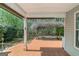 Spacious covered patio with a tile floor and backyard view at 100 Hugh Dr, Covington, GA 30016