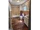 Bathroom with a toilet, sink, shower and vinyl floors at 34 Pine St, Porterdale, GA 30014
