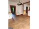 A spacious dining room with wood floors and overhead lighting at 34 Pine St, Porterdale, GA 30014