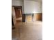A living room with wood floors, wood trim and a fireplace mantle at 34 Pine St, Porterdale, GA 30014