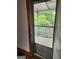A screened in porch with a view of green trees at 34 Pine St, Porterdale, GA 30014