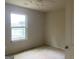 Bedroom featuring a window overlooking a lake and bare floors at 10950 Wheeler Trce, Hampton, GA 30228