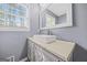 Bathroom features a vessel sink, large mirror and modern faucet at 2511 Due West Nw Cir, Kennesaw, GA 30152