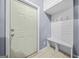Entryway features a built-in bench with hooks and tiled flooring at 2511 Due West Nw Cir, Kennesaw, GA 30152