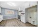 Well-lit kitchen showcasing stainless steel oven range, white cabinetry, and view to dining area at 2511 Due West Nw Cir, Kennesaw, GA 30152